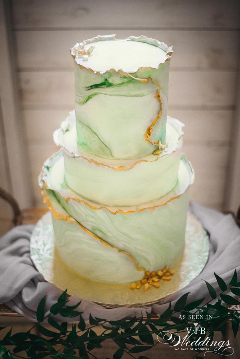 Marbled green cake with gold edging by High Tea Bakery